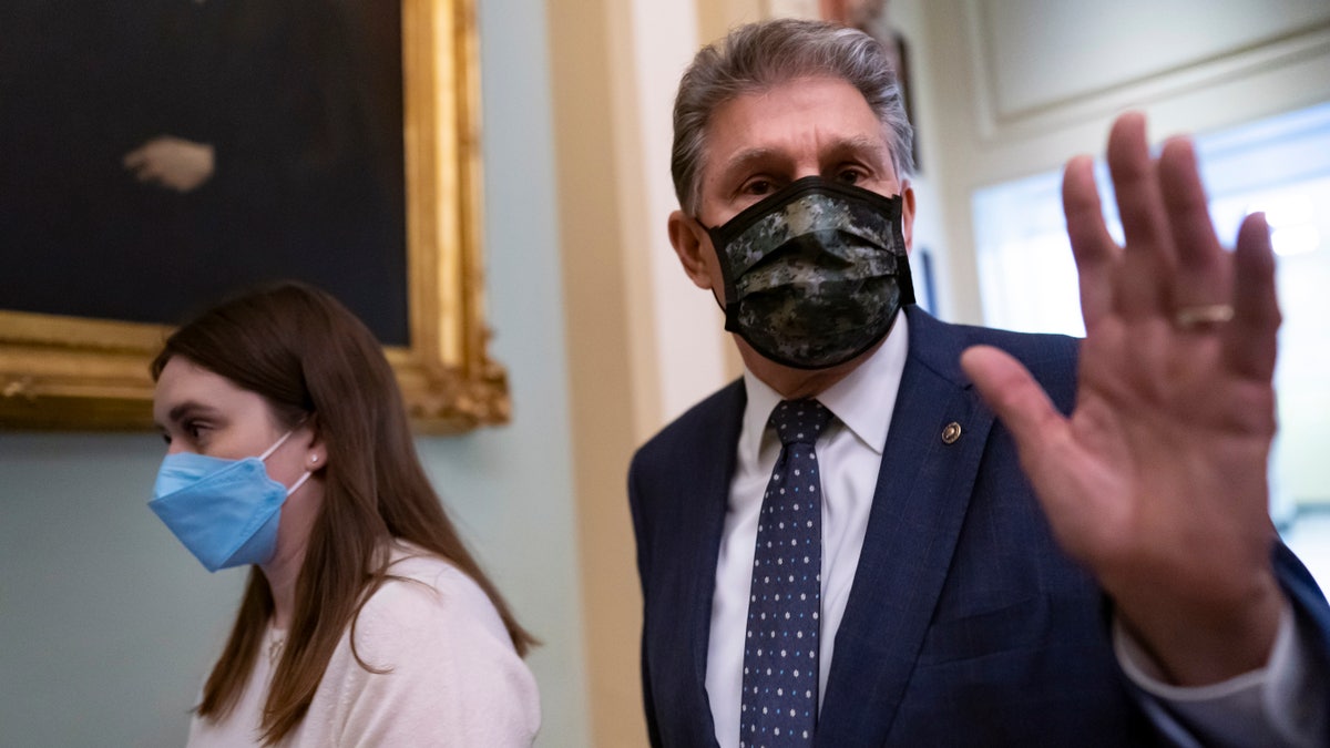 Sen. Joe Manchin, D-W.Va., walks past reporters after attending a lengthy Democratic Caucus meeting as the Senate continues to grapple with end-of-year tasks at the Capitol in Washington, Thursday, Dec. 16, 2021. President Joe Biden's vast social and environment package is in limbo and party leaders' hopes of resolving holdout Sen. Joe Manchin's demands and considering the bill in this year's waning days seem all but dead. (AP Photo/J. Scott Applewhite)