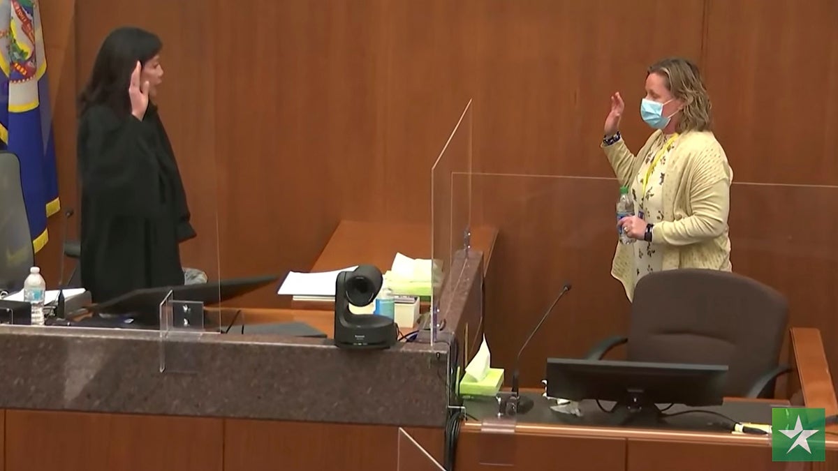 In this screen grab from video, Hennepin County Judge Regina Chu left, swears in former Brooklyn Center Police Officer Kim Potter before she testifies in court Friday, Dec. 17, 2021 at the Hennepin County Courthouse in Minneapolis, Minn.  