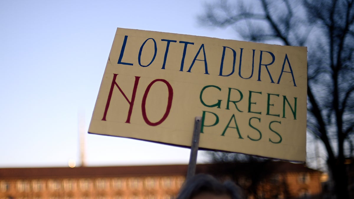 People gather to protest against Italy's covid Green Pass in Turin, Italy, Saturday Dec. 18, 2021. (Fabio Ferrari/LaPresse via AP)