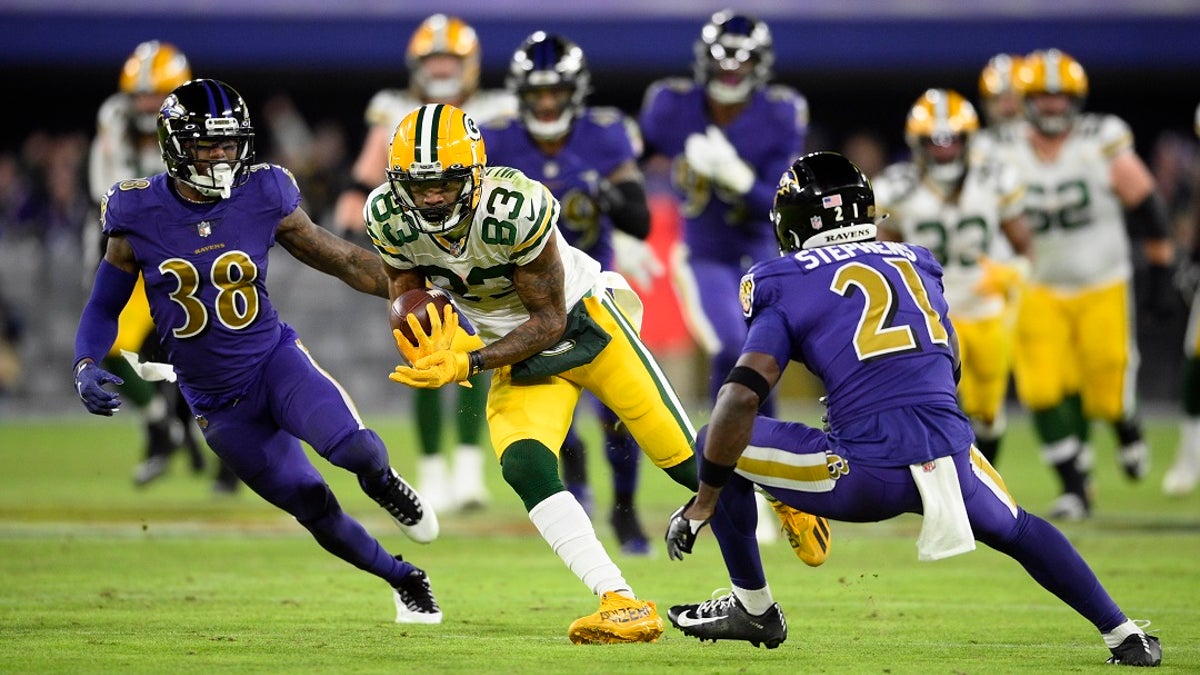 Green Bay Packers wide receiver Marquez Valdes-Scantling (83) rushes past Baltimore Ravens defensive back Kevon Seymour, left, and free safety Brandon Stephens in the second half of an NFL football game on Sunday in Baltimore. (AP Photo/Nick Wass)