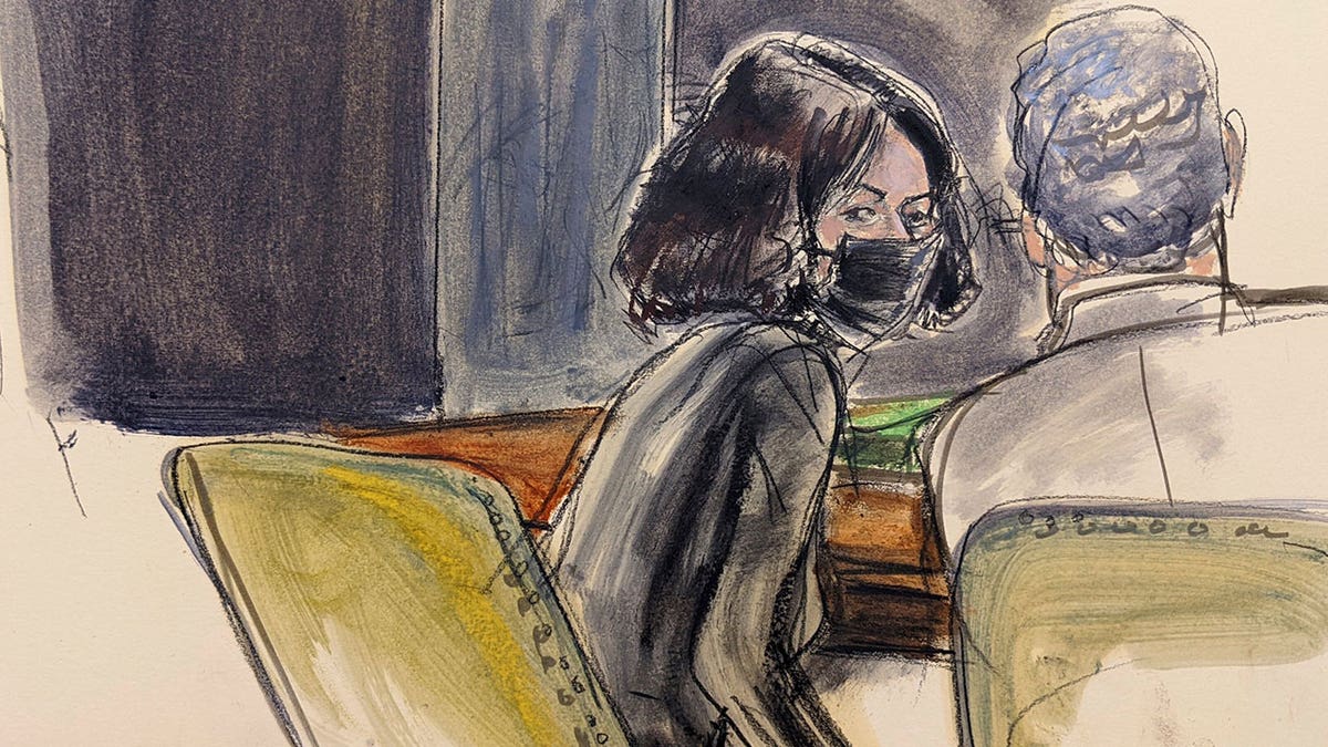 Ghislaine Maxwell, left, speaks to her defense attorney Jeffrey Pagliuca after the reading of the jury's second note during Maxwell's sex trafficking trial, Tuesday, Dec. 21, 2021, in New York. (Elizabeth Williams via AP)