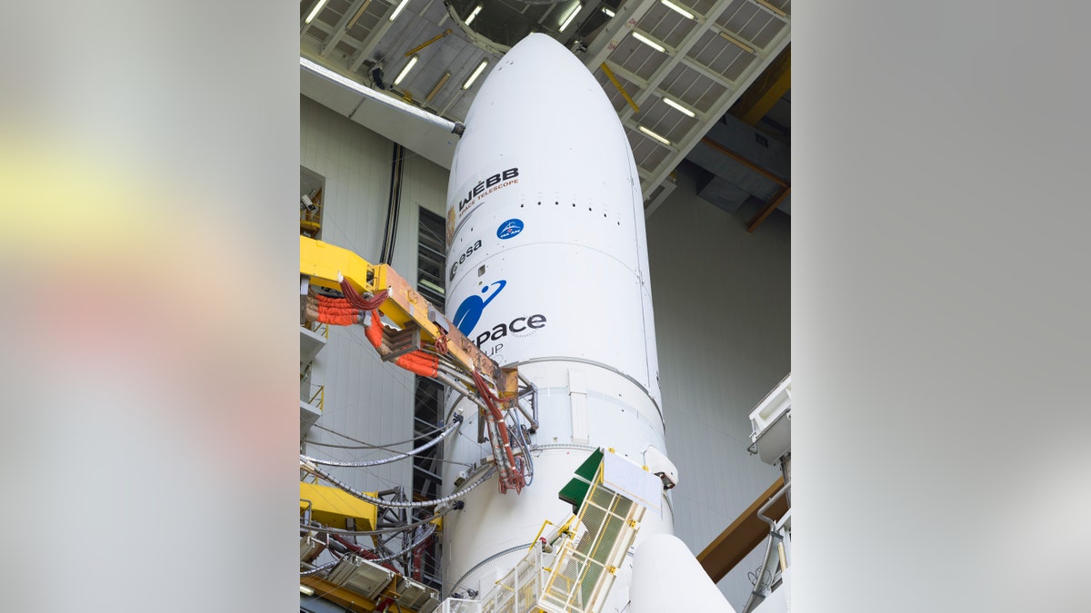 Arianespace's Ariane 5 rocket with NASA's James Webb Space Telescope onboard, is seen in the final assembly building ahead of the planned roll to the launch pad, Thursday, Dec. 23, 2021, at Europe's Spaceport, the Guiana Space Center in Kourou, French Guiana. ?(Chris Gunn/NASA via AP