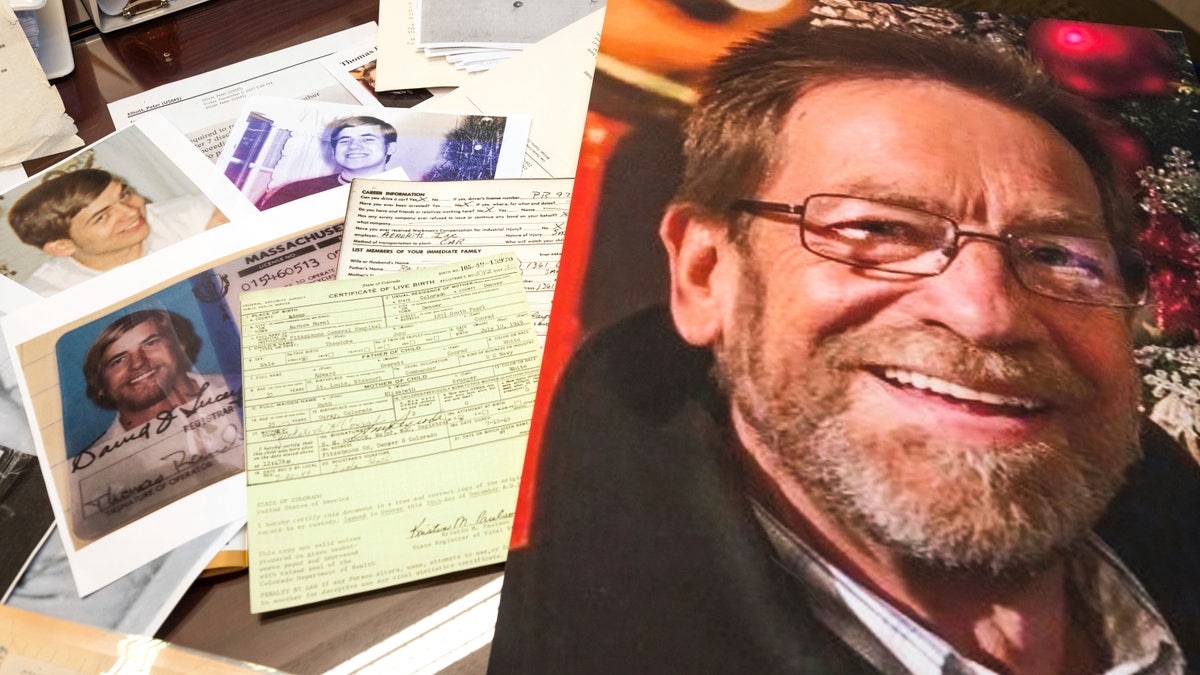 Photos, a driver's license, the original warrant and other items from a 1969 robbery involving Ted Conrad are shown on Dec. 16, 2021 at the Carl B. Stokes U.S. Courthouse in Cleveland. (AP Photo/Ken Blaze)