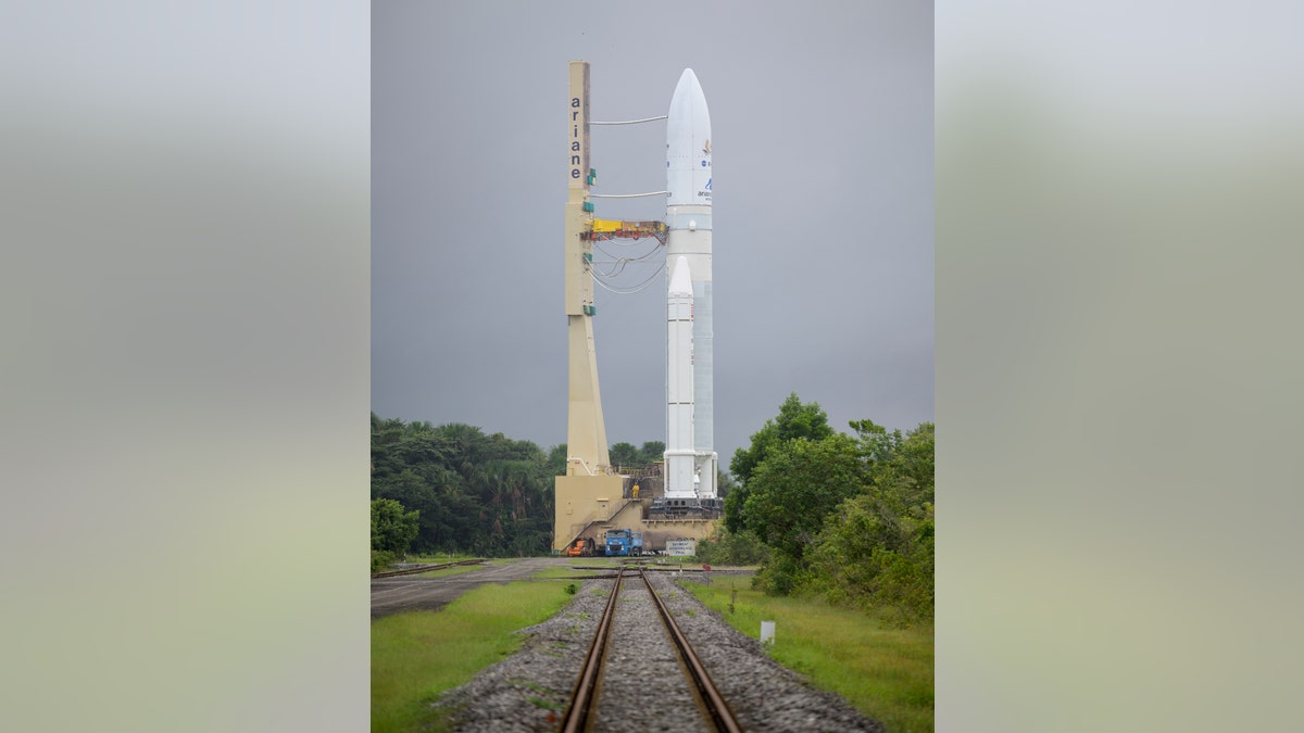 In this image released by NASA, Arianespace's Ariane 5 rocket with NASA's James Webb Space Telescope onboard, is rolled out to the launch pad, Thursday, Dec. 23, 2021, at Europe's Spaceport, the Guiana Space Center in Kourou, French Guiana. (Bill Ingalls/NASA via AP)