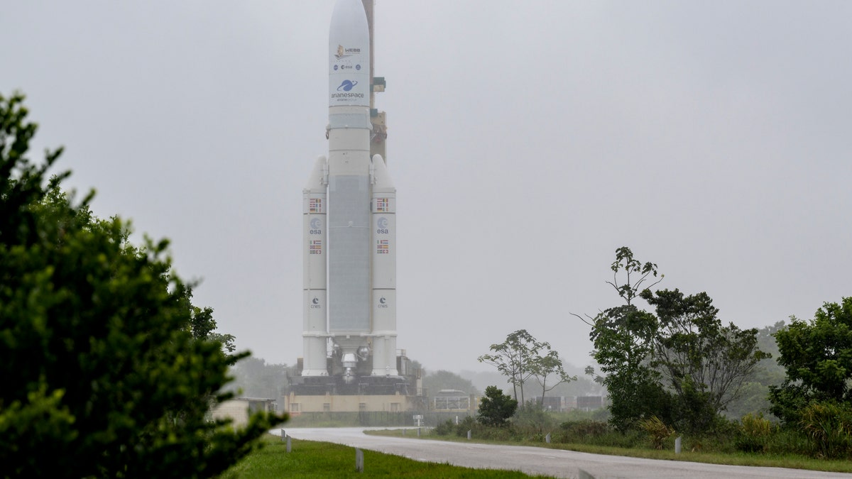 In this image released by NASA, Arianespace's Ariane 5 rocket with NASA's James Webb Space Telescope onboard, is rolled out to the launch pad, Thursday, Dec. 23, 2021, at Europe's Spaceport, the Guiana Space Center in Kourou, French Guiana. (Bill Ingalls/NASA via AP)