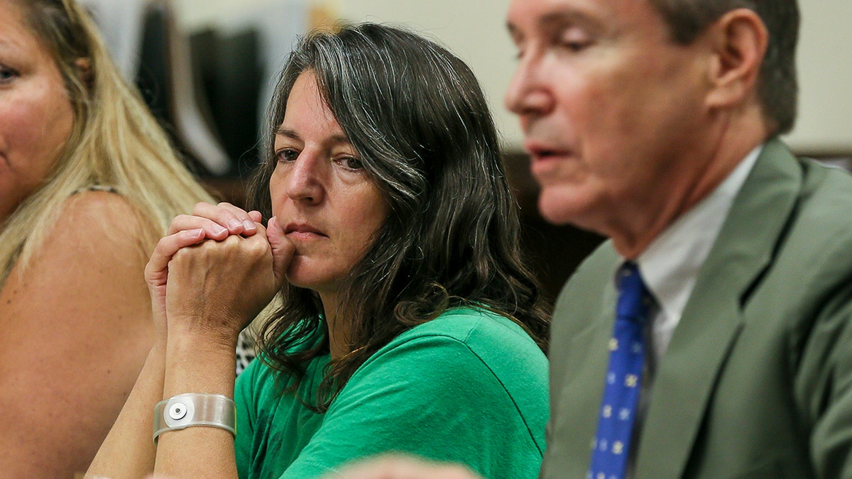 Michelle Lodzinski listens to her attorney, Gerald Krovatin, during a motion to get her a new trial in Superior Court, in New Brunswick, New Jersey, Aug. 23, 2016. (Associated Press)