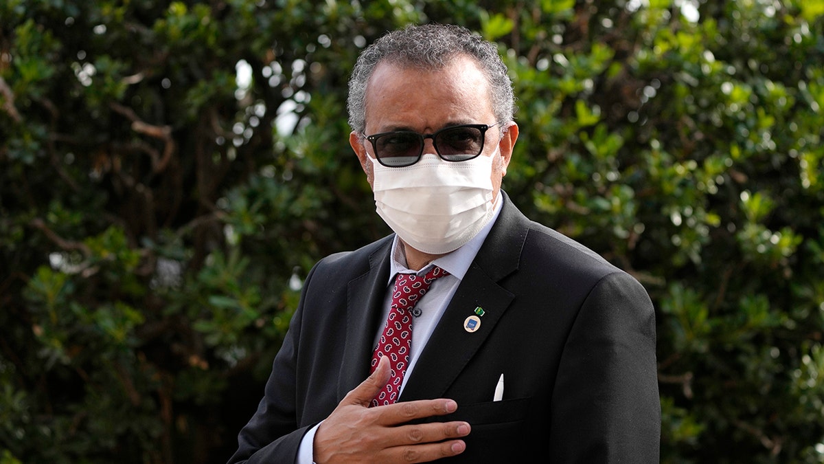 FILE - World Health Organization Tedros Adhanom Ghebreyesus waves as he arrives for a meeting of G20 finance and health ministers at the Salone delle Fontane (Hall of Fountains) in Rome, Oct. 29, 2021. 