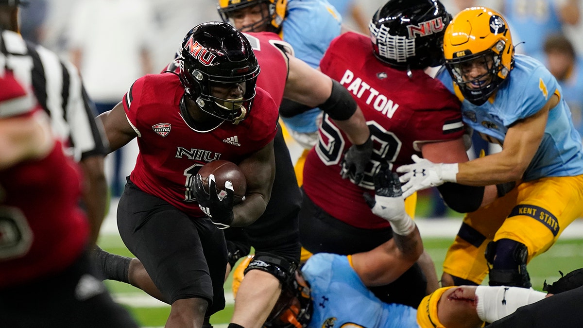 Northern Illinois' Antario Brown rushes during the first half against Kent State, Saturday, Dec. 4, 2021, in Detroit.