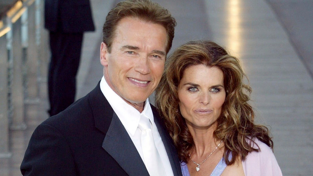 Arnold Schwarzenegger and Maria Shriver pose for a photo