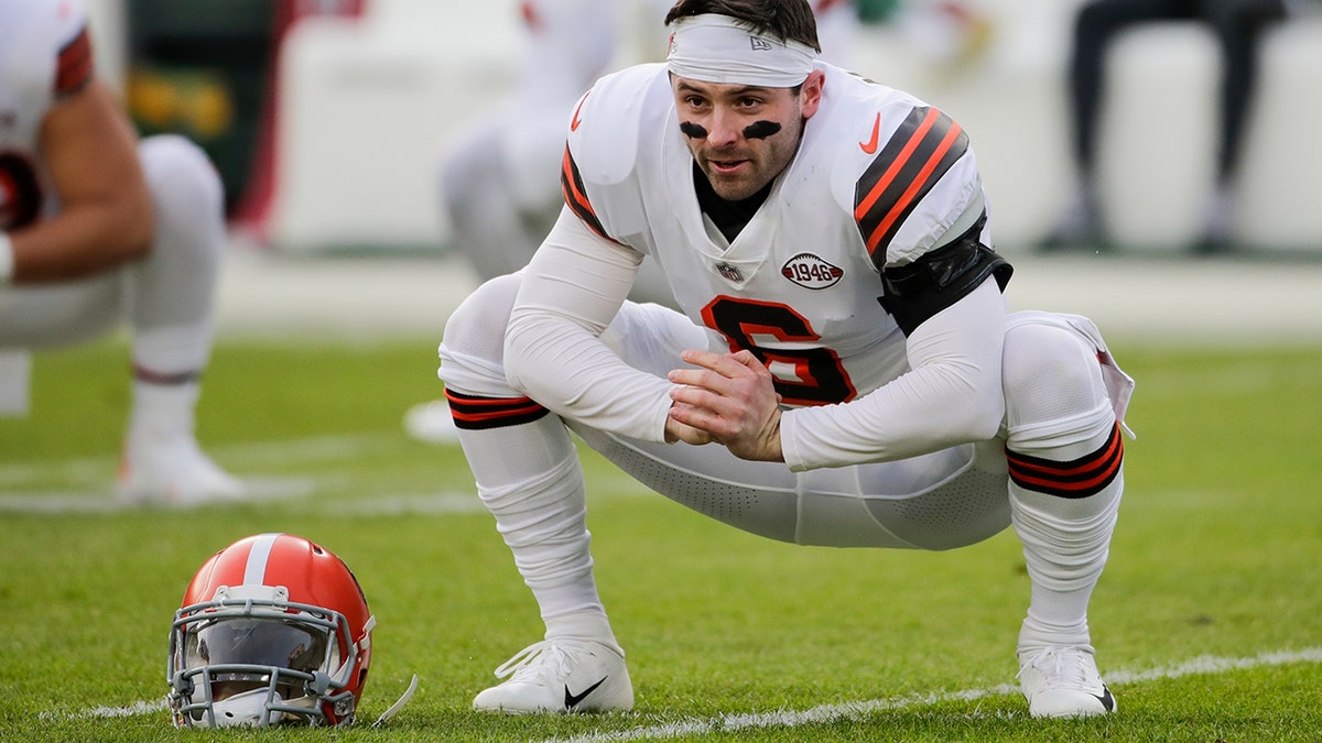 Cleveland Browns' Baker Mayfield warms up before an NFL football game against the Green Bay Packers Saturday, Dec. 25, 2021, in Green Bay, Wis.