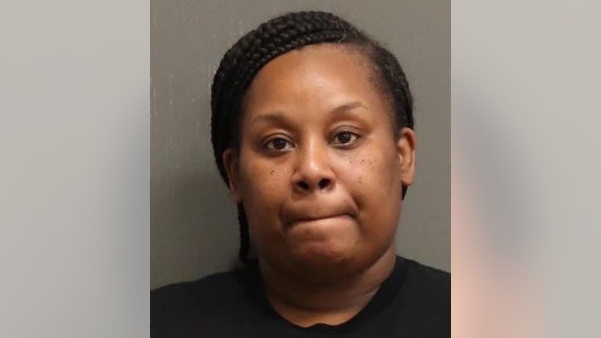 A Nashville mom was arrested Thursday after carrying a semi-automatic handgun into a high school during a physical fight between students, authorities said.