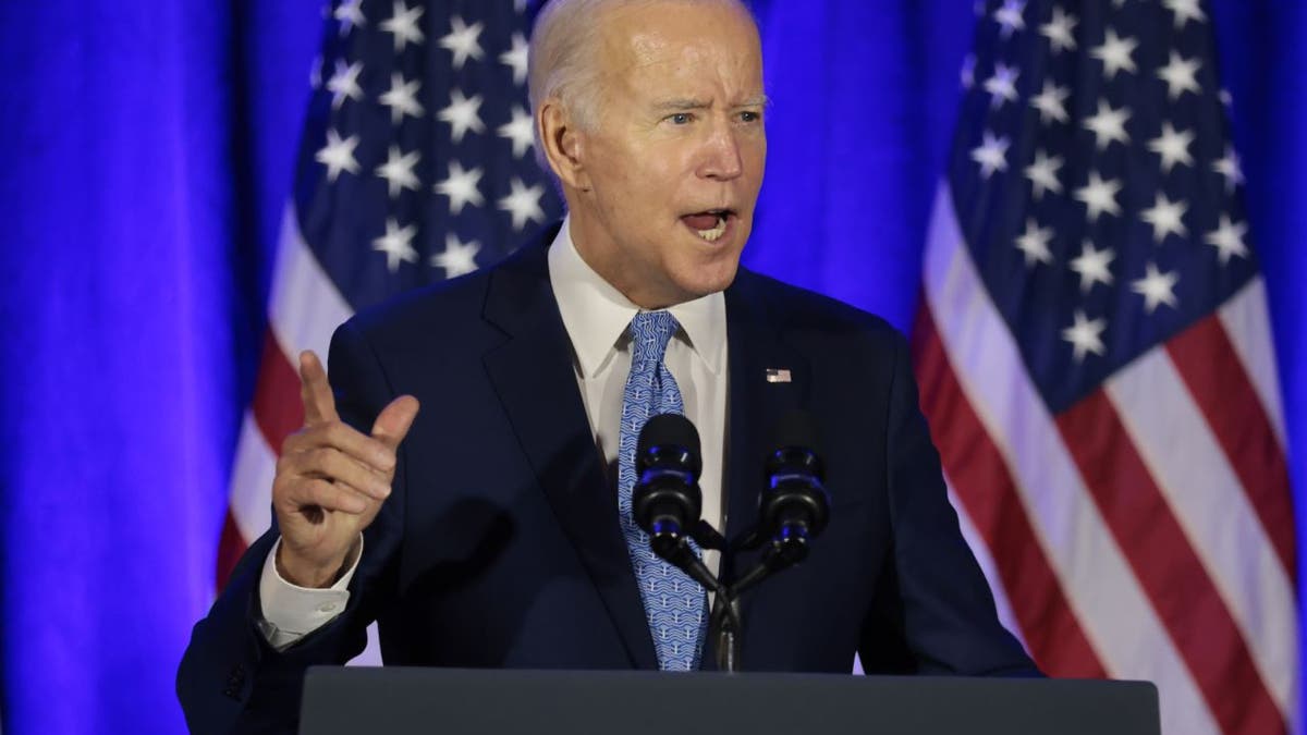 President Joe Biden speaks during the holiday celebration for the Democratic National Committee in Washington on Dec. 14, 2021.