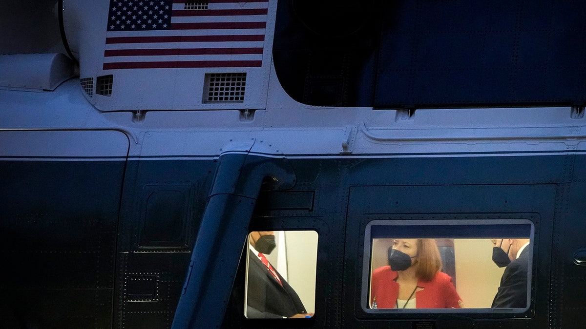 White House Press Secretary Jen Psaki and President Biden sit in Marine One prior to lifting off on the South Lawn of the White House Dec. 17, 2021, in Washington, D.C. 