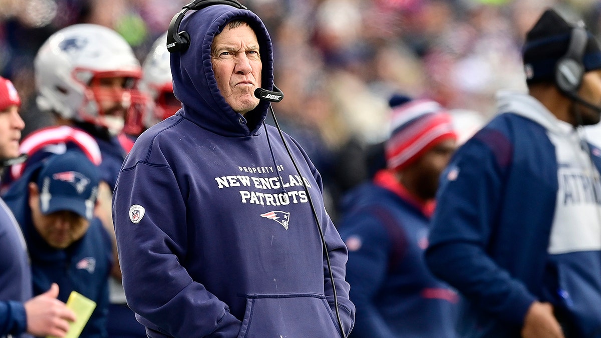 Head coach Bill Belichick of the New England Patriots looks on from the sidelines during the second quarter against the Buffalo Bills at Gillette Stadium on Dec. 26, 2021, in Foxborough, Massachusetts.