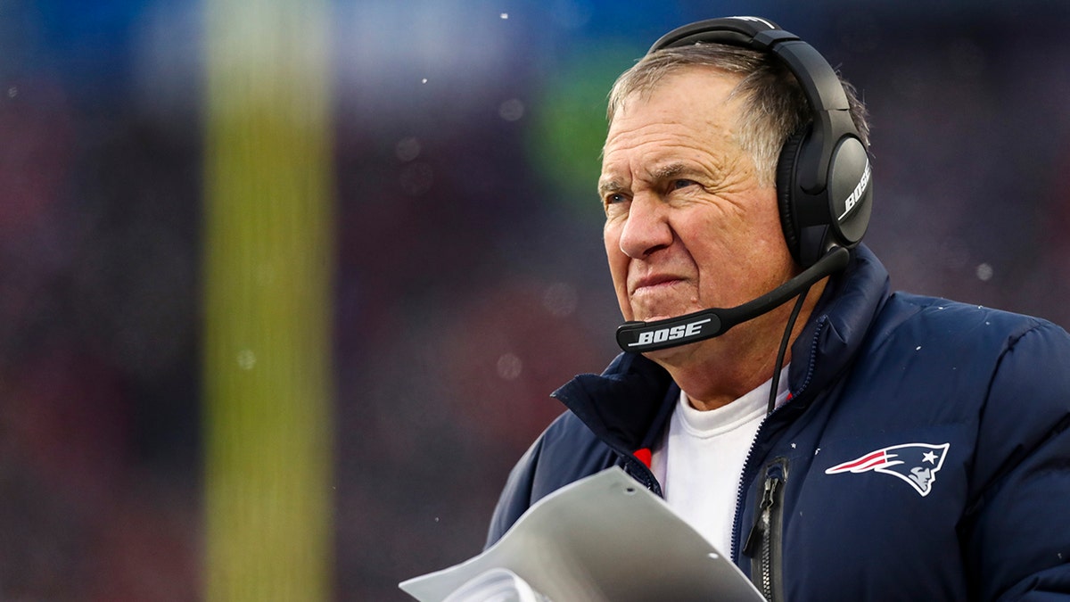 Head coach Bill Belichick of the New England Patriots looks on from the sideline during the second half of the game against the Tennessee Titans at Gillette Stadium on Nov. 28, 2021, in Foxborough, Massachusetts.