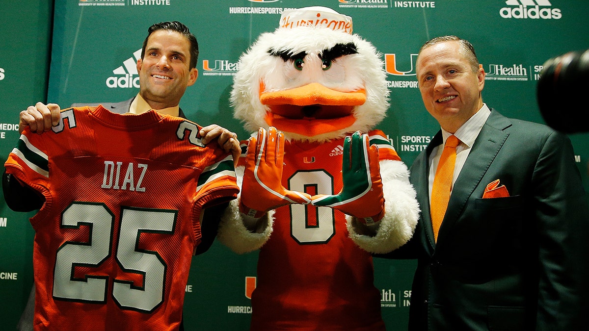 CORAL GABLES, FL - JANUARY 02:  Head coach Manny Diaz of the Miami Hurricanes (L) poses for a photo with athletic director Blake James after the introductory press conference in the Mann Auditorium at the Schwartz Center on January 2, 2019 in Coral Gables, Florida. 