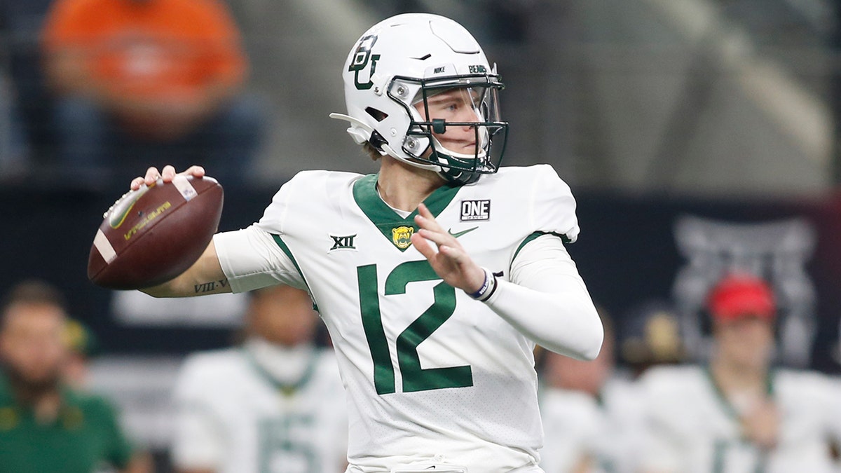 Baylor quarterback Blake Shapen (12) throws a pass against Oklahoma State in the Big 12 Conference championship in Arlington, Texas, Saturday, Dec. 4, 2021.