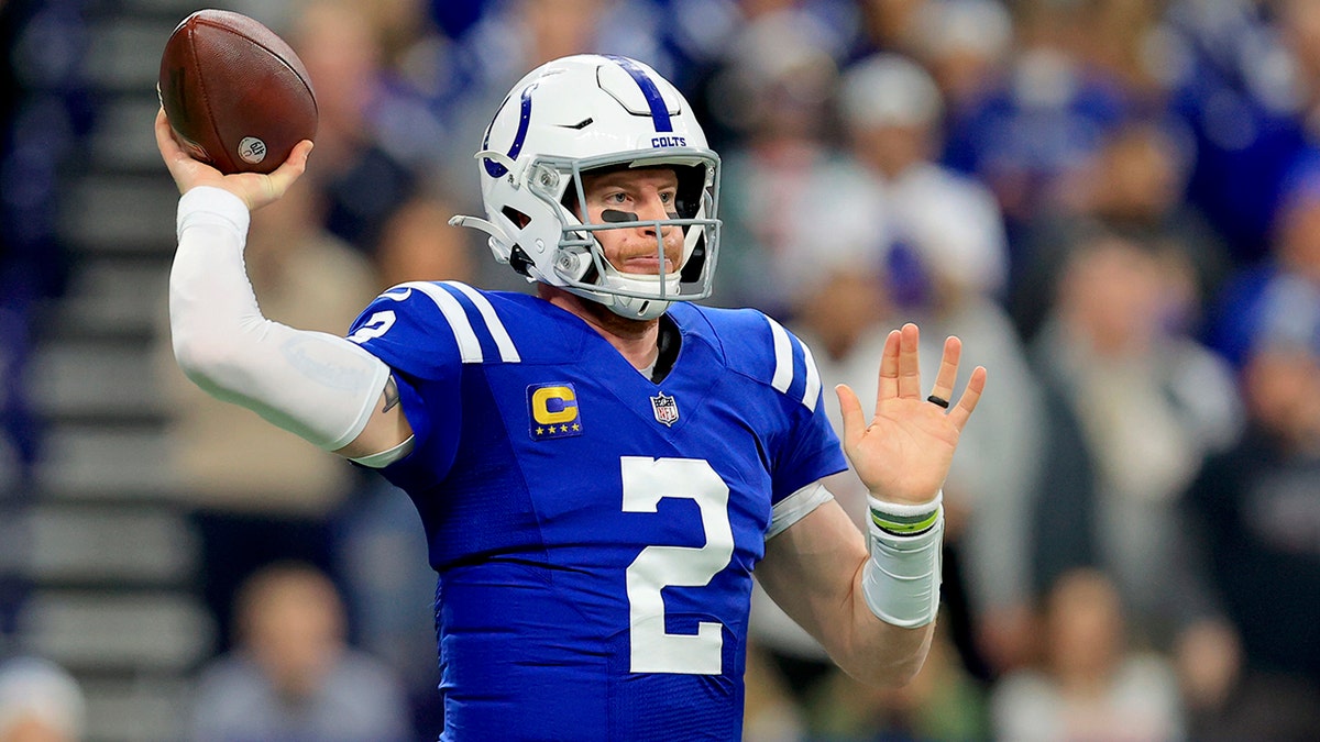 Indianapolis Colts quarterback Carson Wentz throws during the first half of an NFL football game against the New England Patriots Saturday, Dec. 18, 2021, in Indianapolis.