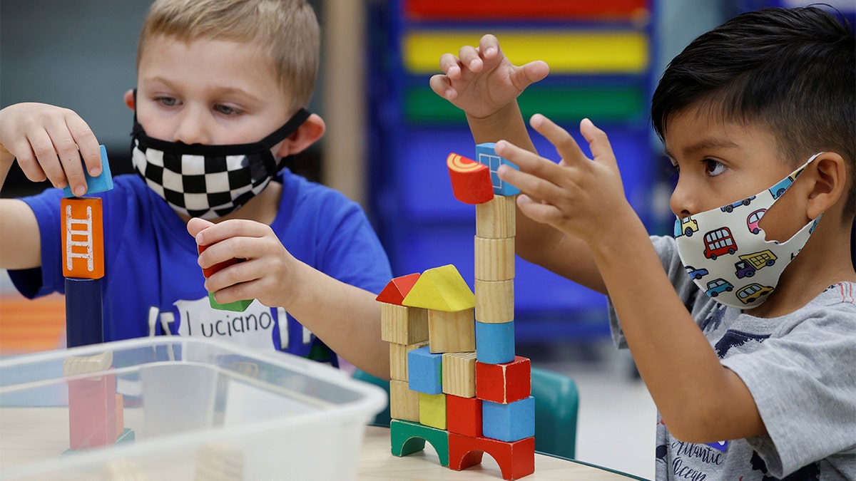 Children wear masks and wait for President Biden to visit their pre-kindergarten class at East End Elementary School to highlight the early childhood education proposal in his Build Back Better infrastructure agenda in North Plainfield, New Jersey, Oct. 25, 2021.