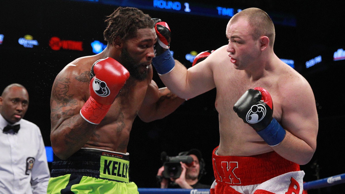 Adam Kownacki (white/red) lands a right hand against Danny Kelly at the Barclays Center in Brooklyn Jan. 16, 2016. Kownacki would win by unanimous decision.