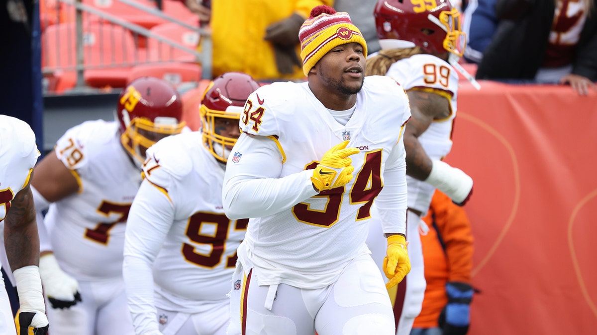 Daron Payne #94 of the Washington Football Team runs out to the field before the game against the Denver Broncos at Empower Field At Mile High 