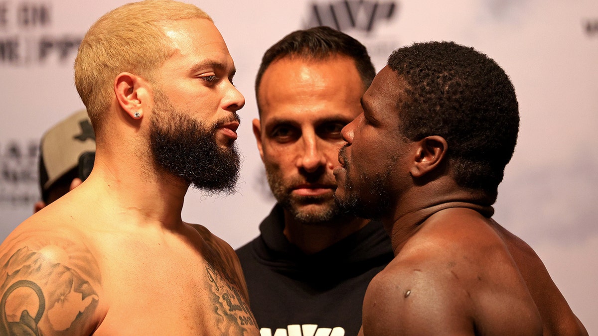 TAMPA, FLORIDA - DECEMBER 17: Deron Williams and Frank Gore pose during a weigh in at the Hard Rock Hotel and Casino ahead of this weekends fight on December 17, 2021 in Tampa, Florida.