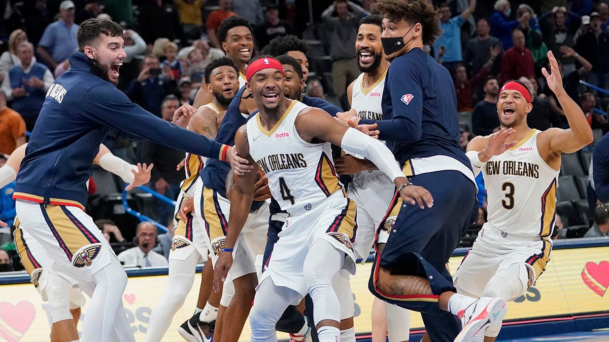 New Orleans Pelicans guard Devonte' Graham (4) celebrates with teammates after hitting the game winning basket to end the second half of an NBA basketball game against the Oklahoma City Thunder, Wednesday, Dec. 15, 2021, in Oklahoma City.