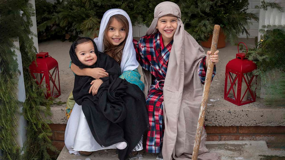 Some of the Duffy children are shown honoring the true meaning of the Christmas season. This sweet photo and many others appear in ‘All American Christmas.’?