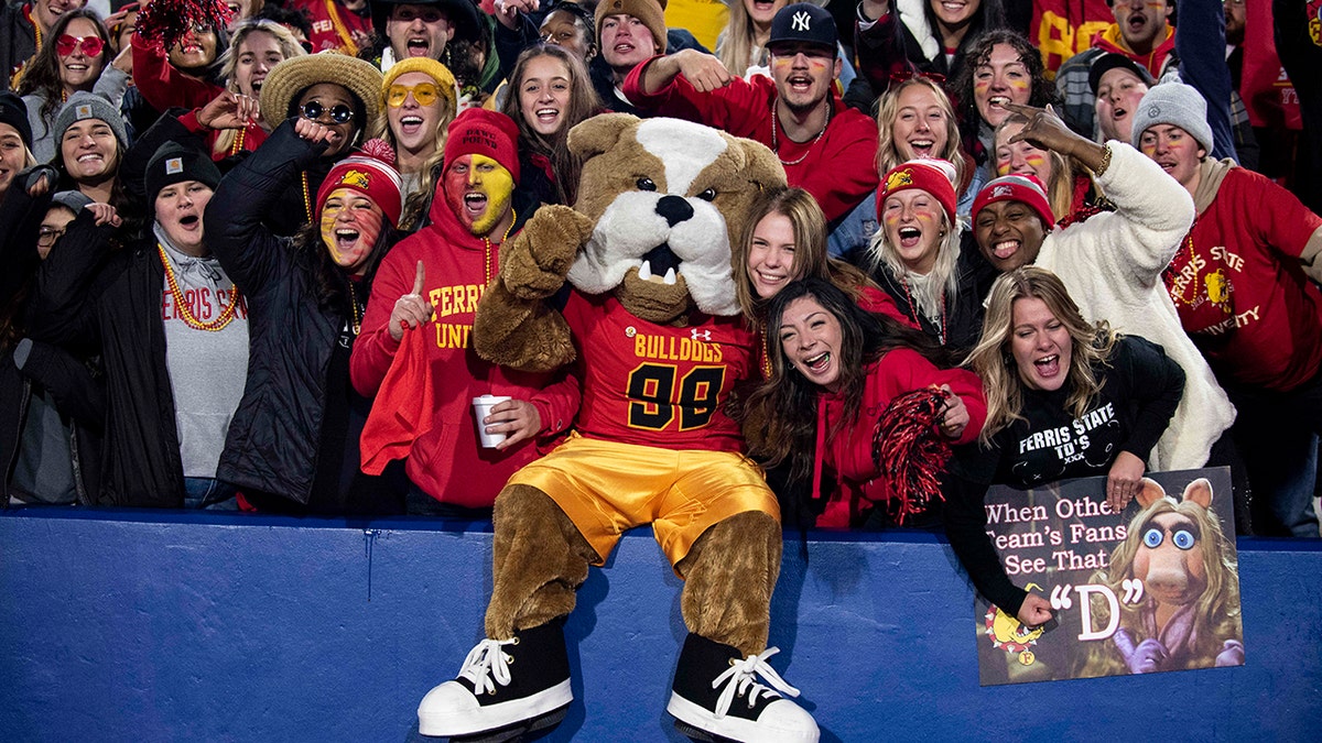 The Ferris State bulldog celebrates a touchdown with fans in the first half of the Division II championship NCAA college football game against Valdosta State in McKinney, Texas, Saturday, Dec. 18, 2021.