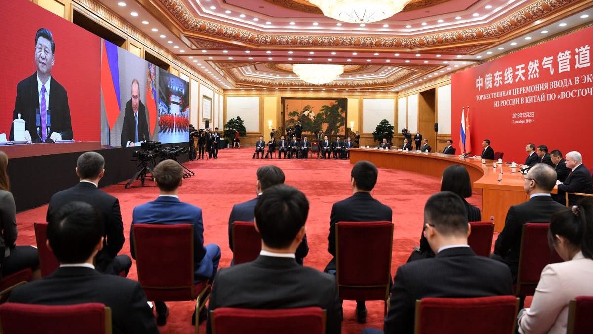 BEIJING, CHINA - DECEMBER 02: Chinese President Xi Jinping speaks with Russian President Vladimir Putin via a video link, from the Great Hall of the People on December 2, 2019 in Beijing, China.
