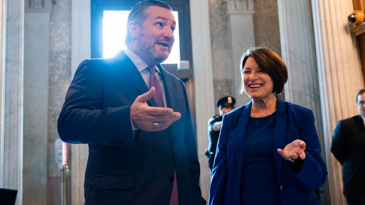 UNITED STATES - MAY 26: Sens. Ted Cruz, R-Texas, and Amy Klobuchar, D-Minn., are seen in the Capitol during a vote on Wednesday, May 26, 2021.