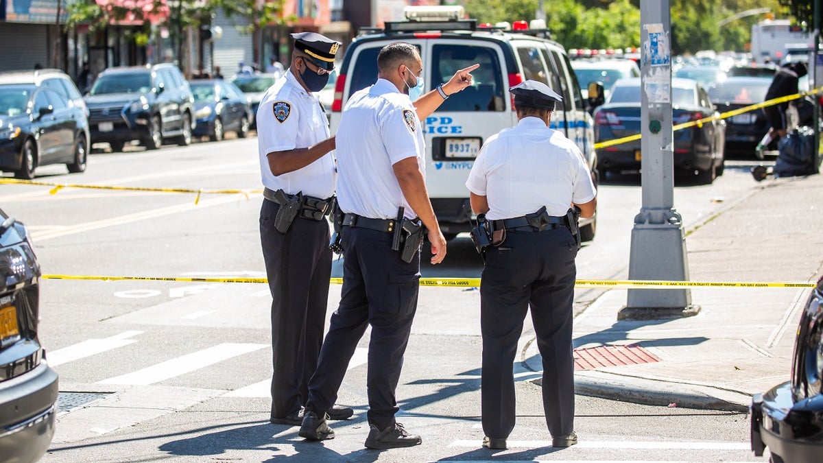 NYPD officers monitor a crime scene in the 73th precinct in the Brownsville neighborhood of Brooklyn borough Sept. 19, 2021.?