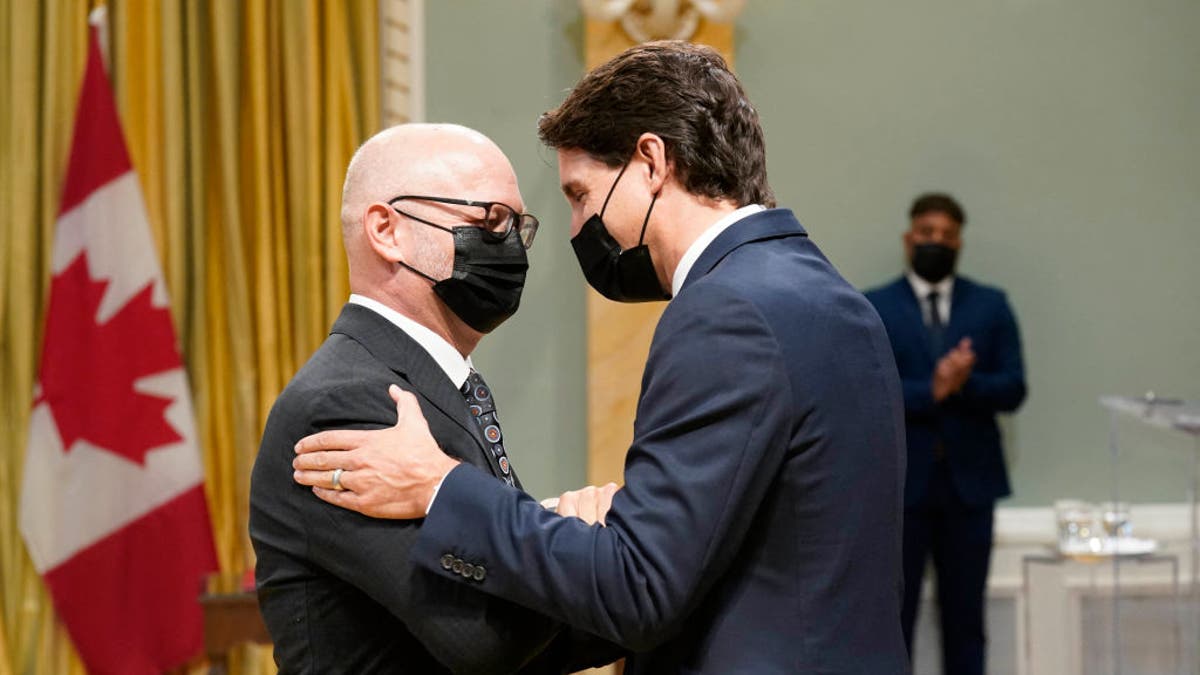 Canada's Prime Minister Justin Trudeau speaks with Minister of Justice and Attorney General of Canada David Lametti during the swearing-in of the 29th Canadian Ministry at Rideau Hall in Ottawa, on Oct., 26, 2021