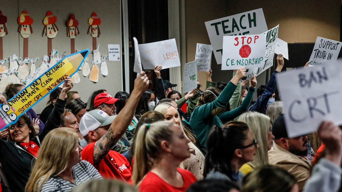 An even mix of proponents and opponents to teaching Critical Race Theory are in attendance as the Placentia Yorba Linda School Board in Yorba Linda, California, on Tuesday, Nov. 16, 2021, discusses a proposed resolution to ban it from being taught in schools. 