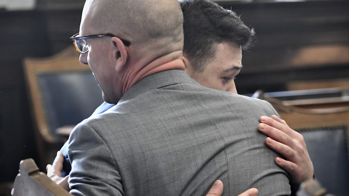 Kyle Rittenhouse hugs one of his attorneys, Corey Chirafisi, after he is found not guilty in his trial at the Kenosha County Courthouse on November 19, 2021 in Kenosha, Wisconsin.  (Photo by Sean Krajacic - Pool/Getty Images)