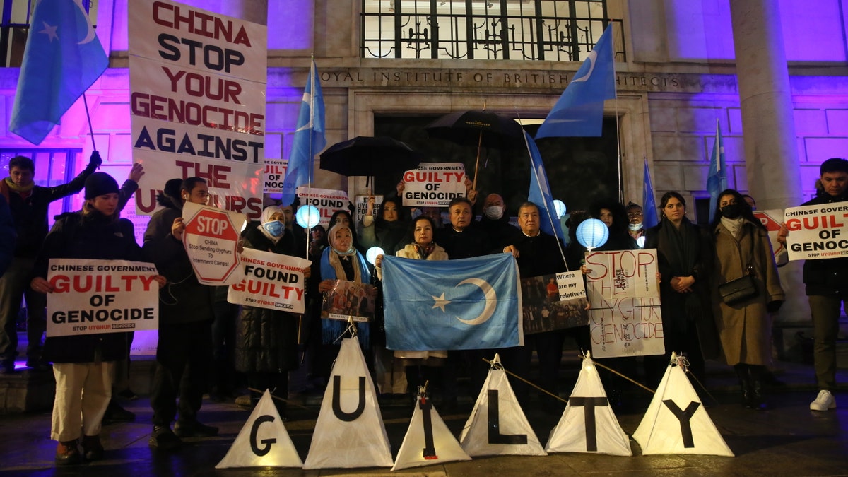 People stage a protest in front of the Chinese Embassy after the Uyghur Tribunal ruled that China committed genocide against Uyghurs and other ethnic minorities through policies such as coerced birth control and sterilization in London, United Kingdom on Dec. 9, 2021.