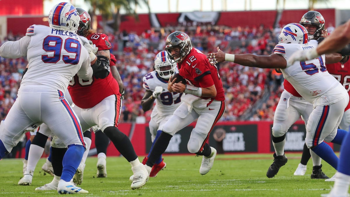 Buccaneers quarterback Tom Brady runs the ball for a first down against the Buffalo Bills on Dec. 12, 2021, at Raymond James Stadium in Tampa, Florida.