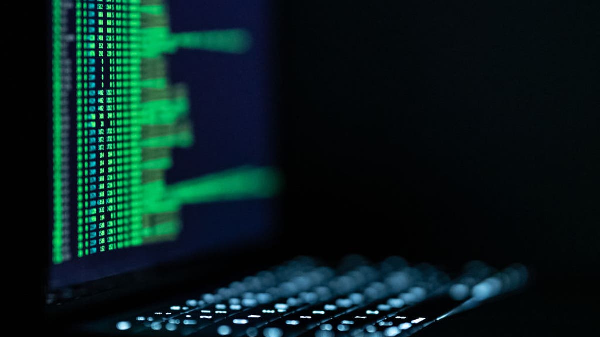 A hacker software is open on a laptop