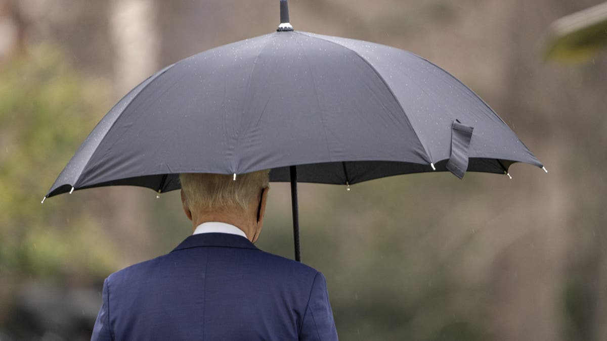 U.S. President Joe Biden walks on the South Lawn of the White House before boarding Marine One in Washington, D.C., U.S., on Monday, Dec. 27, 2021. Biden's medical adviser said a domestic travel vaccination rule should be considered as the omicron variant fuels record Covid-19 case loads in some states and holiday travel continues to be disrupted around the U.S. Photographer: Ken Cedeno/UPI/Bloomberg via Getty Images