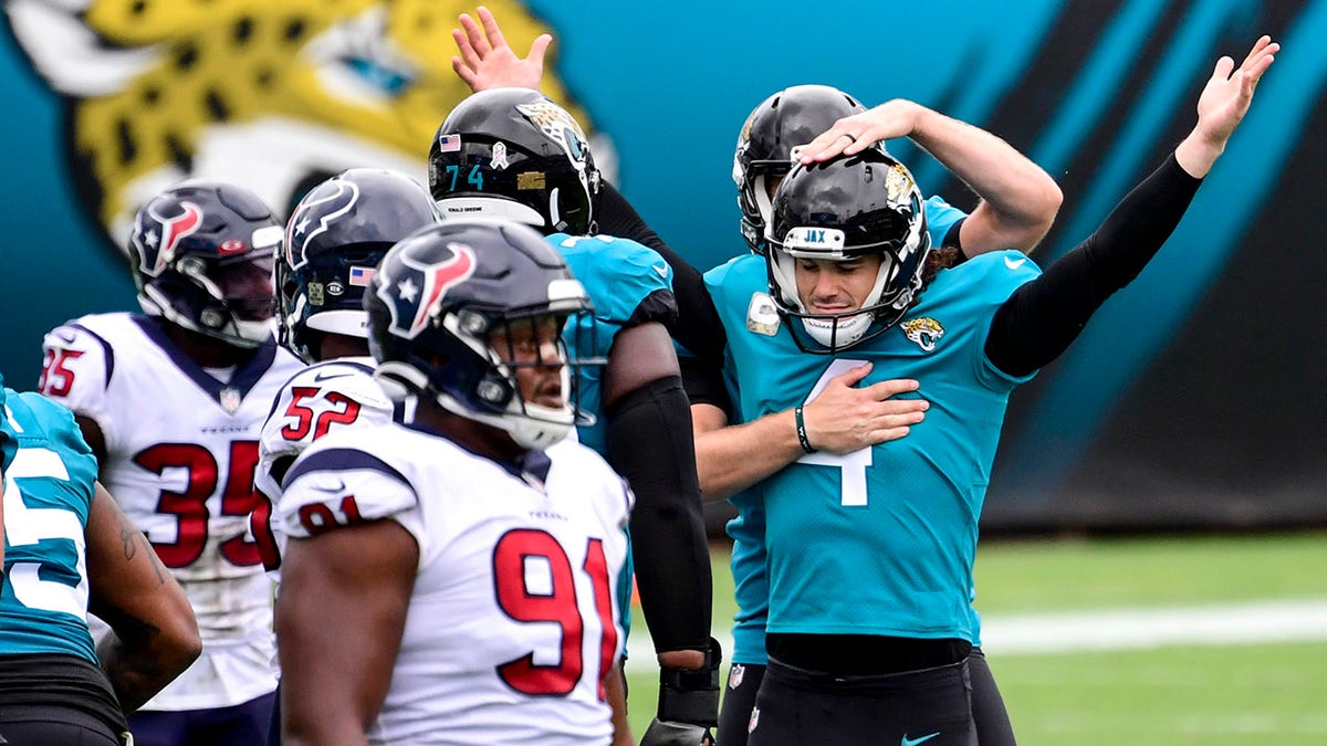 Josh Lambo #4 of the Jacksonville Jaguars reacts after kicking a 59 yard field goal at the end of the first half against the Houston Texans at TIAA Bank Field on November 08, 2020 in Jacksonville, Florida.