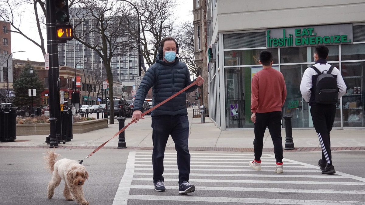 EVANSTON, ILLINOIS - MARCH 23: People walk around the downtown business district on March 23, 2021 in Evanston, Illinois. The City Council of Evanston voted yesterday to approve a plan, which may be the first of its kind in the nation, to make reparations available to Black residents due to past discrimination. To be eligible, residents must have either lived in or be a direct descendant of a Black person who lived in Evanston between 1919 to 1969 and who suffered housing discrimination because of city ordinances, policies or practices. (Photo by Scott Olson/Getty Images)