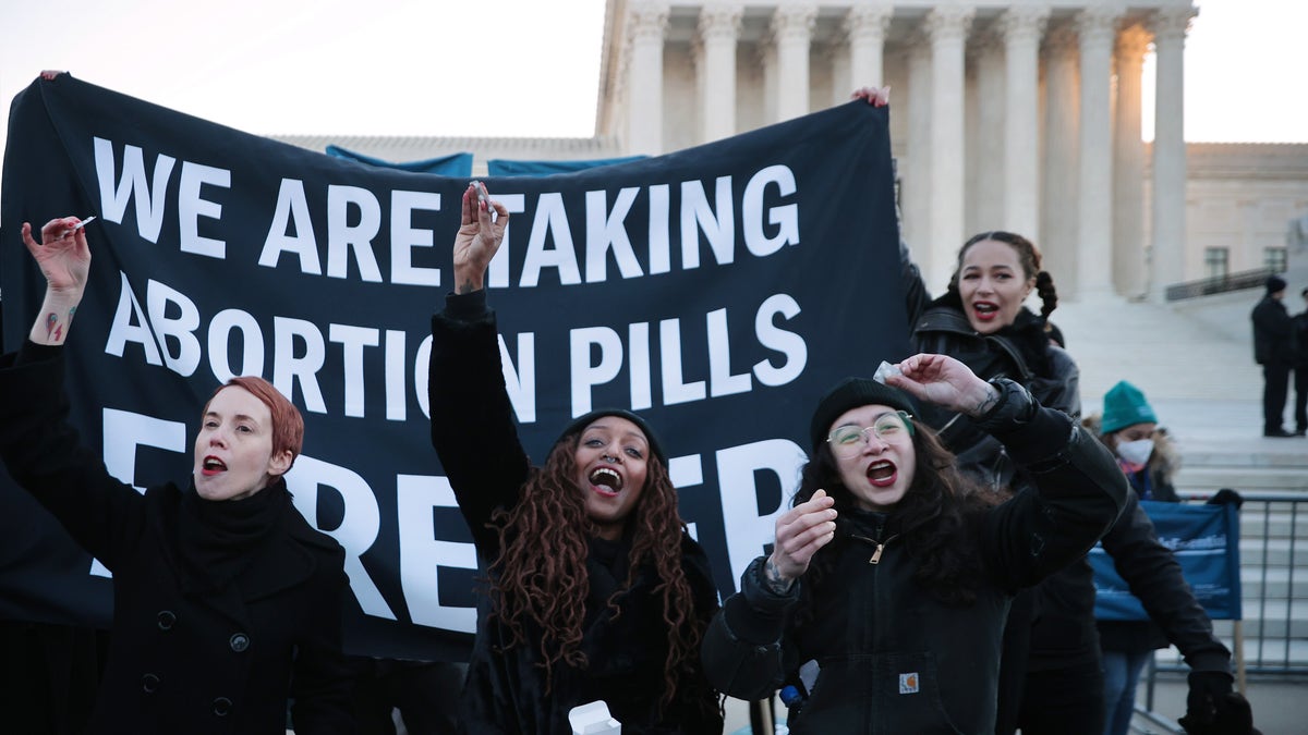 Activists take abortion pill