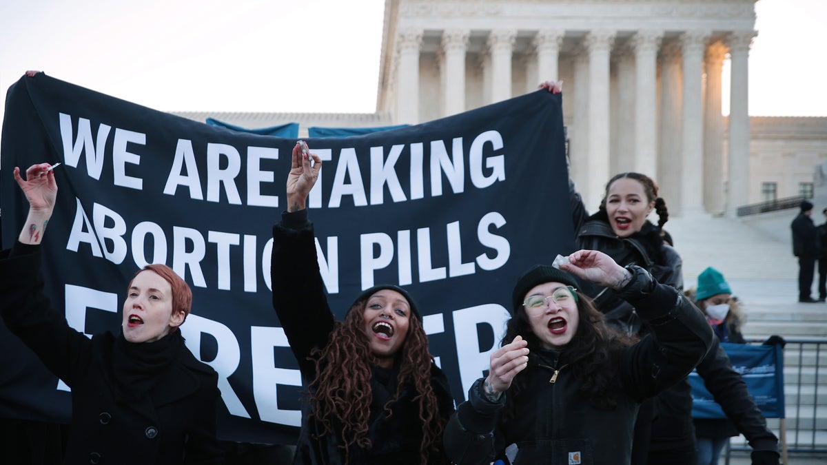 Activists take abortion pill