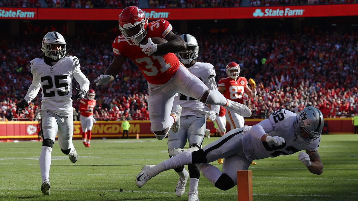 Darrel Williams (31) of the Kansas City Chiefs dives across the goal line for a touchdown during the first quarter against the Las Vegas Raiders at Arrowhead Stadium Dec. 12, 2021, in Kansas City, Missouri. 