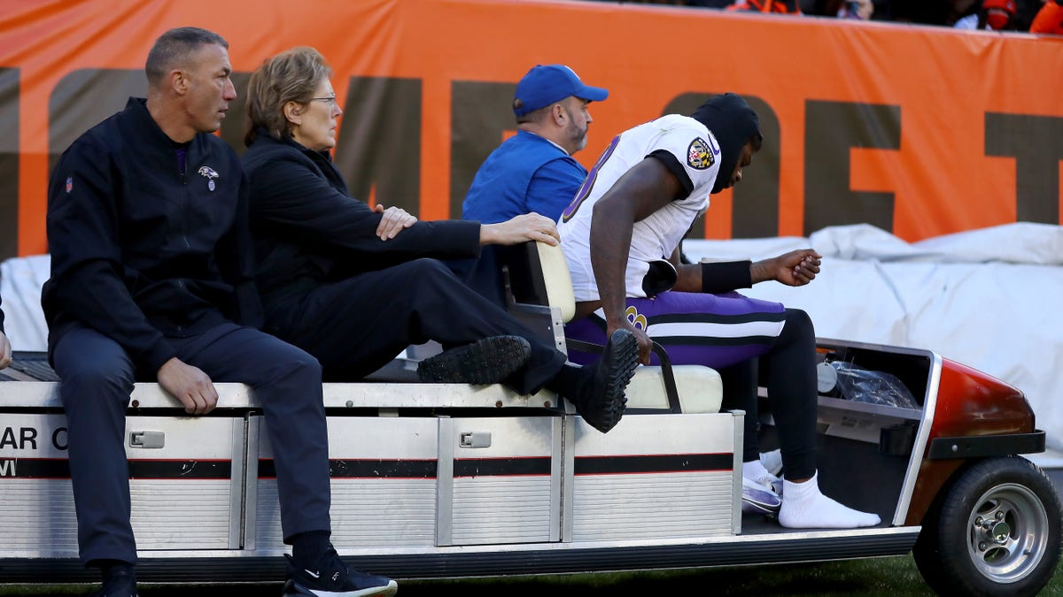 Lamar Jackson of the Baltimore Ravens is carted off the field after suffering an injury in the first half against the Cleveland Browns at FirstEnergy Stadium Dec. 12, 2021 in Cleveland. 