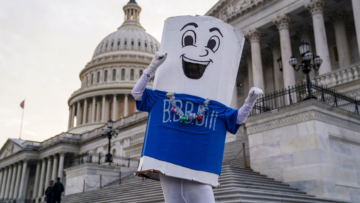 WASHINGTON, DC - DECEMBER 15: MoveOn supporters and students attend a sit in for a Build Back Better "Jingle Back Better" action on the Senate Steps of the U.S. Capitol on December 15, 2021 in Washington, DC. (Photo by Leigh Vogel/Getty Images for MoveOn)