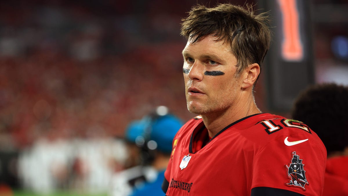 Tom Brady of the Tampa Bay Buccaneers watches from the sidelines during the second quarter of the game against the New Orleans Saints at Raymond James Stadium on Dec. 19, 2021, in Tampa, Florida. 