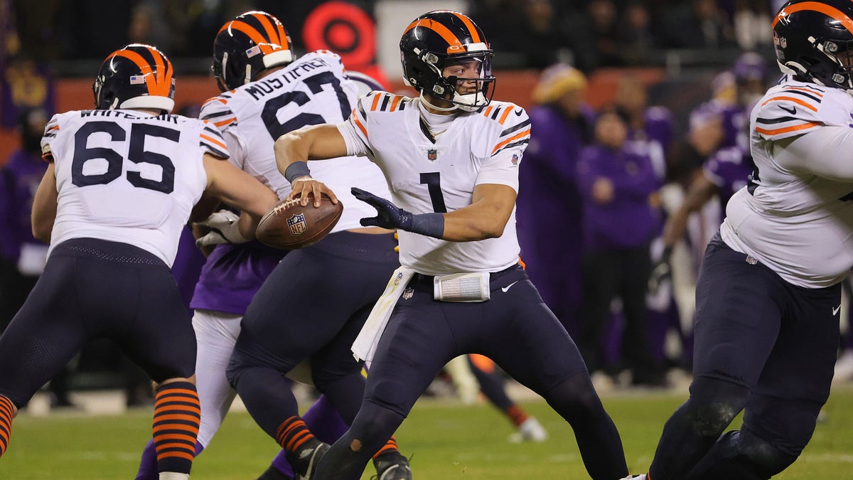 Justin Fields of the Bears looks to pass against the Minnesota Vikings at Soldier Field on Dec. 20, 2021, in Chicago, Illinois.