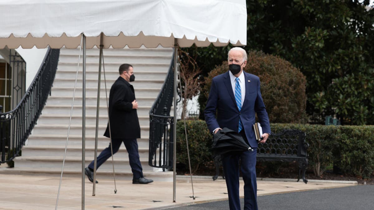President Biden walks to speak with reporters on the South Lawn before departing from the White House on Marine One 