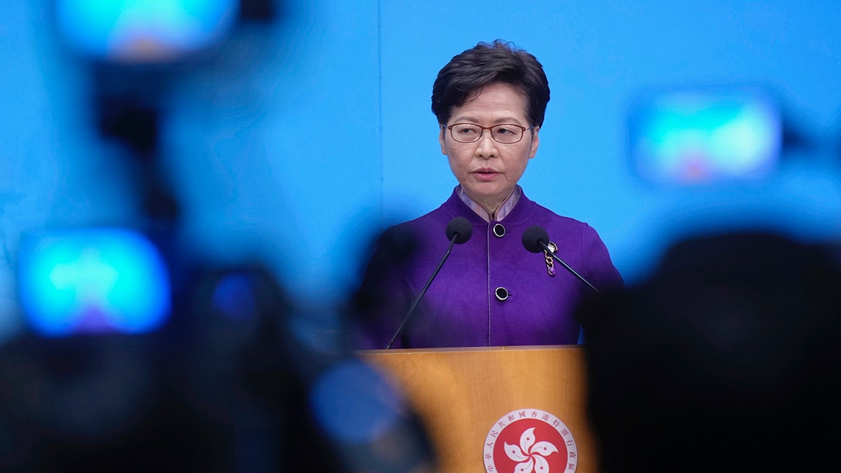 Hong Kong Chief Executive Carrie Lam listens to reporters' questions during a press conference in Hong Kong, Monday, Dec. 20, 2021. 